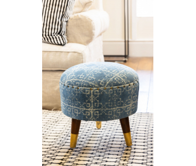 blue upholstered stool with 3 legs