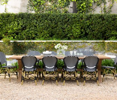 Outdoor round dining table in Iroko