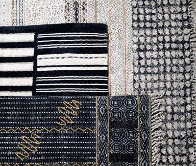 indus rug in black with mustard squiggle