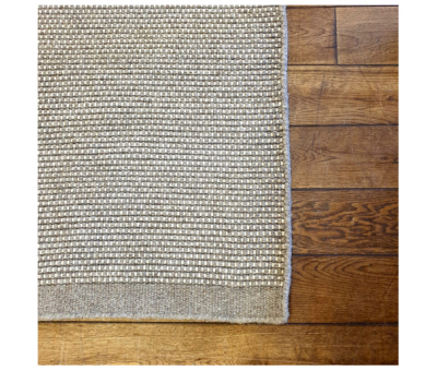 Block & Chisel beige wool rug with beige trim