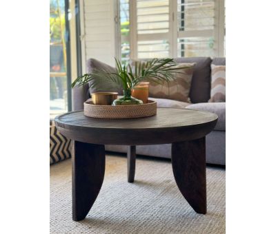 round wooden coffee table with 3 legs