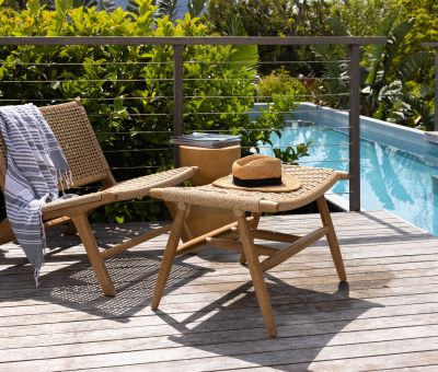 Outdoor lounge chair with teak frame and synthetic rope weave