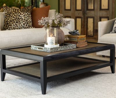 black frame coffee table with rattan inlay and bottom shelf 