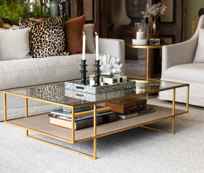 Gold metal frame coffee table with glass top and rattan inlay bottom shelf