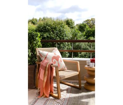 Outdoor lounge chair with teak frame and synthetic rope weave