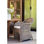 Block & chisel kubu rattan armchair with white seat cushion