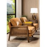 Modern armchair in leather with rattan inlay on arms