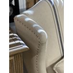 upholstered wingback with turned wooden legs