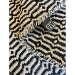 Block & Chisel stone coloured wool rug with black pattern detail