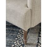 Upholstered armchair with wooden legs linen