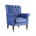 upholstered armchair with deep button detail and castors