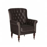 upholstered armchair with deep button detail and castors