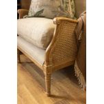 French style wingback chair with rattan detail 