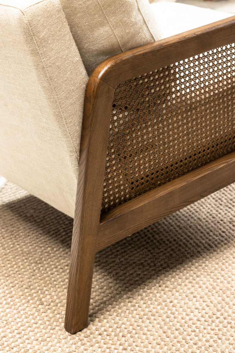 Modern armchair in cream with rattan inlay on arms