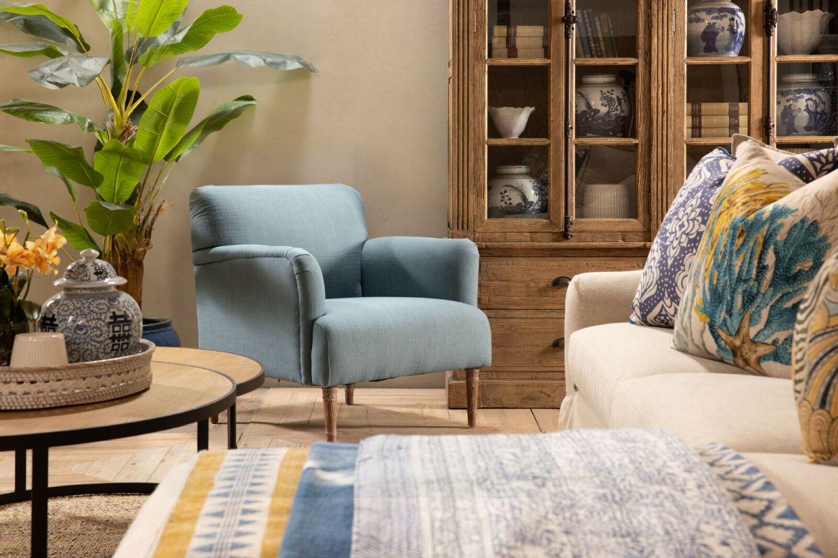 Upholstered armchair with wooden legs teal