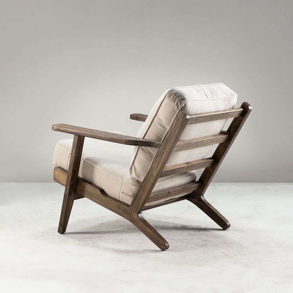 Modern armchair, wooden frame with light grey back and seat cushion