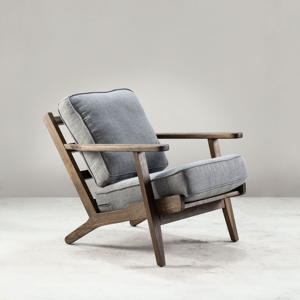 Modern armchair, wooden frame with light grey back and seat cushion