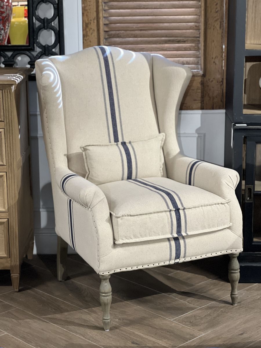 upholstered wingback with turned wooden legs