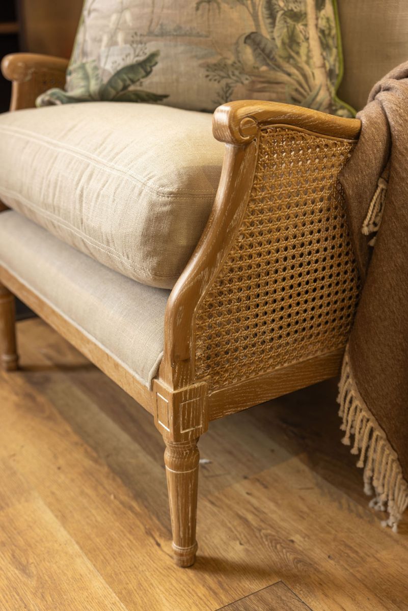 French style wingback chair with rattan detail 